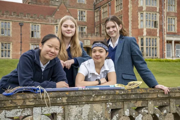 Students on the terrace in front of the main building