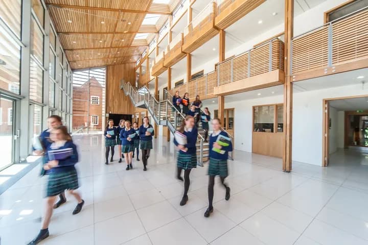 Students in a modern school atrium