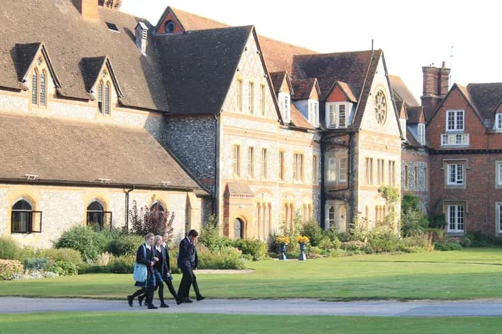 Students walking past historic buildings