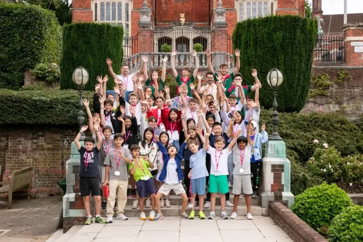 Summer students on the steps at Harrow