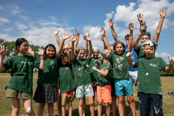 Students celebrating after a water game