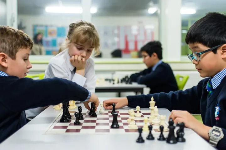 Pupils playing chess