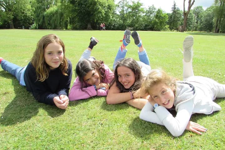 Girls relaxing on the lawn